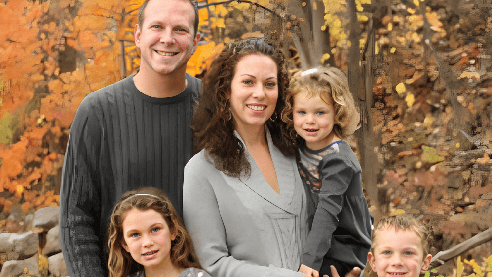 Family portrait with fall foliage background.